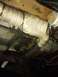 1995 Ford Bronco - Underside view of a vehicle's exhaust system, showing heat wrap and various components.