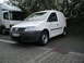 2009 Holden Commodore - A white panel van is parked next to a larger truck on a paved lot.