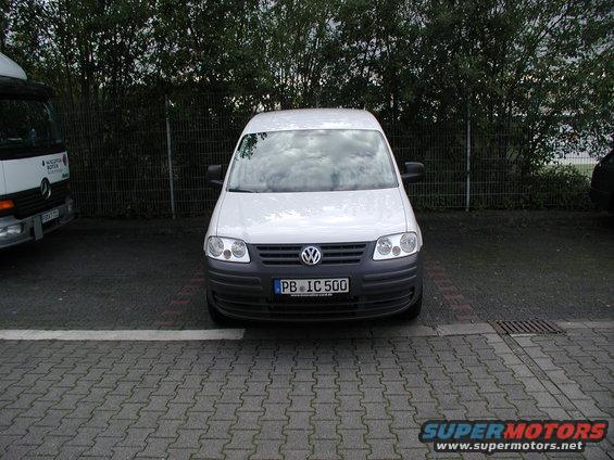 White Volkswagen Caddy van parked, license plate PB IC 500