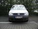 2009 Holden Commodore - White Volkswagen Caddy van parked outdoors, showing its front grille and headlights.