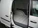 2009 Holden Commodore - The spacious, utilitarian cargo area of a white van is shown with the side door ajar.