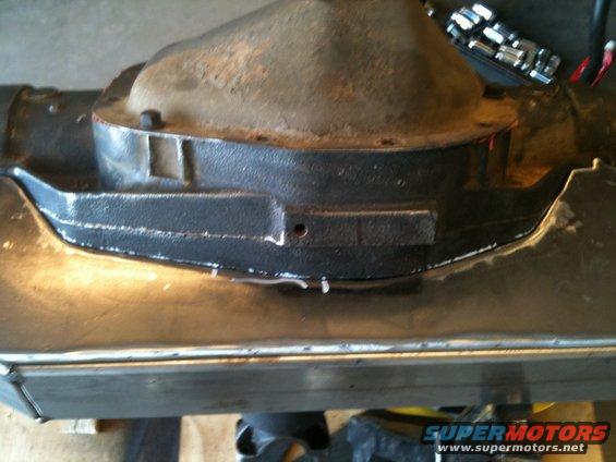 Close-up of a rear axle differential housing with some metal fabrication around it