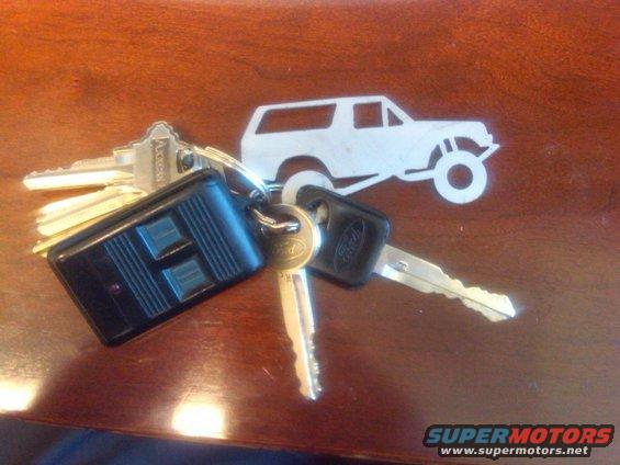 Bunch of keys with a Ford Bronco keychain on a wooden table