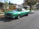 1979 Ford Ranchero - A green 1977 Ford Ranchero is parked on a residential street.