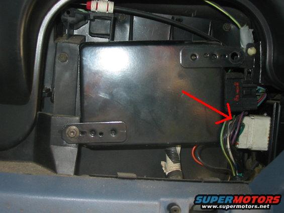 Interior wiring harness with red arrow pointing to connectors