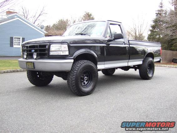 Black 1995 Ford F-150 pickup truck, 3/4 front view