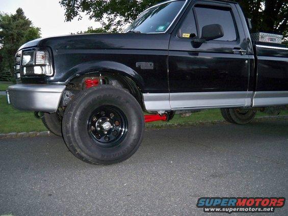 1995 Ford F-150 pickup truck, front quarter view, black with silver trim