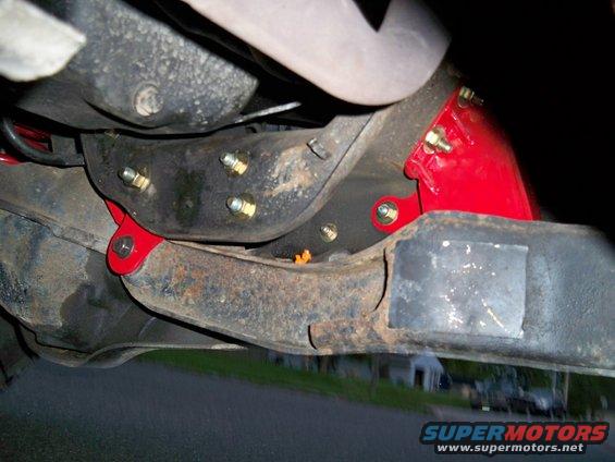 Red suspension parts on truck undercarriage