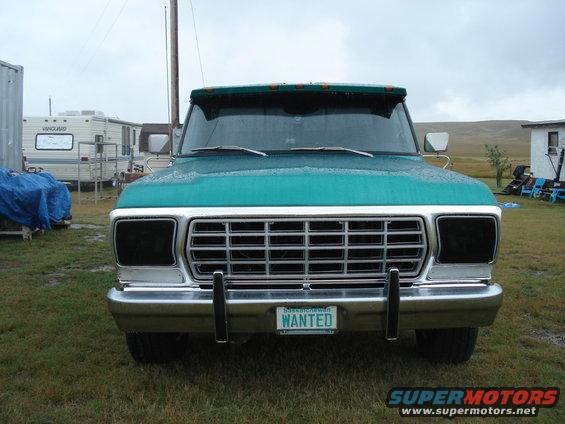Teal 1979 Ford F-150 front view, chrome grille, "WANTED" license plate