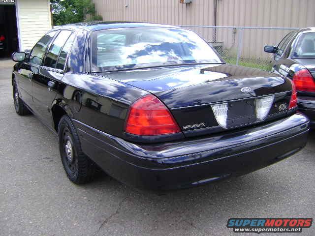 Black 2003 Ford Crown Victoria rear 3/4 view