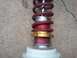 2003 Acura TL - A close-up view of a coilover shock absorber, likely a performance aftermarket part.
