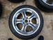 2003 Acura TL - A single aftermarket wheel with a polished finish is shown, resting on a concrete surface.