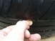 2003 Acura TL - Tire tread depth is being measured with a penny.