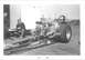 1965 Ford 427 - A dragster with a prominent engine and 'CONNIE KALITTA Ford' branding is parked near a trailer.