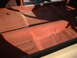 1964 Ford Fairlane - The interior floor pan of a vehicle, coated in red primer, is visible. The registry information suggests it might be a 1964 Ford Fairlane.