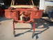 1964 Ford Fairlane - The front section of a car is mounted on a rolling stand, awaiting restoration.