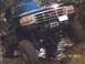 1994 Ford Bronco - This lifted Ford Bronco is navigating a rocky trail, showing off its off-road capabilities.
