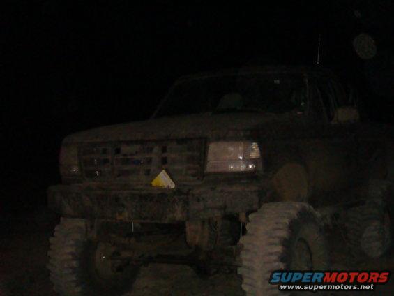 1992 Ford Bronco front view, covered in mud