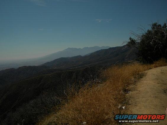 Mountain landscape with dry grass and a dirt path