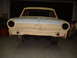 1964 Ford Fairlane - A 1964 Ford Fairlane body in primer is shown from the front, awaiting restoration.