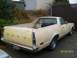 1978 Ford Ranchero - Rear view of a 1977 Ford Ranchero pickup truck with a tow hitch and a box in the bed.