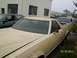 1978 Ford Ranchero - A 1978 Ford Ranchero is parked in front of a building with other vehicles nearby.