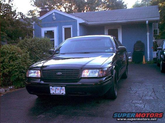 Black 2000 Ford Crown Victoria front view with custom license plate