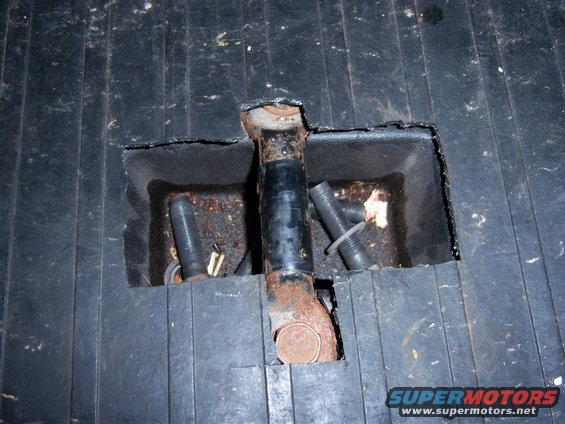Child seat tether anchor in black floor mat
