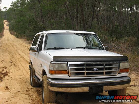 White 1994 Ford Bronco on dirt road