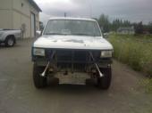 White Ford Bronco front view with aftermarket bumper and air horns