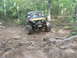 1996 Ford Bronco - A modified Jeep Wrangler navigates a challenging off-road course.