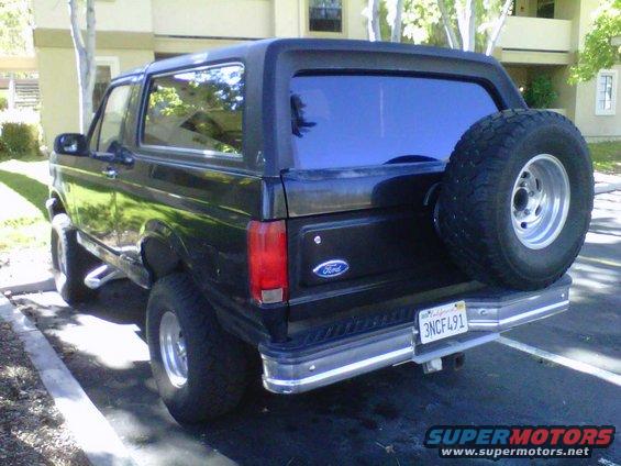 Black 1995 Ford Bronco rear view with spare tire
