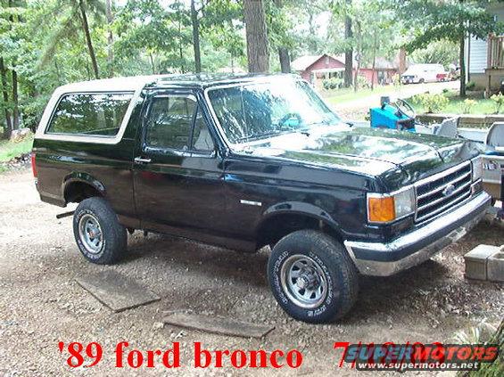 im000354.jpg This was my Bronco the day after I got it.Fresh paint without the tan on it. No mirrors,chrome over wheels.