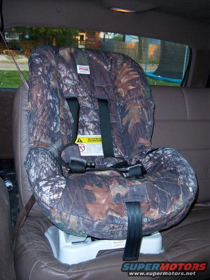 Camo child seat installed in a vehicle's back seat