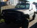 1980 Jeep Cherokee - This 1980 Jeep Cherokee features an aftermarket bumper and appears to have a lifted suspension.
