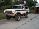 1978 Ford Bronco - This 1978 Ford Bronco features a two-tone paint scheme, a roof rack, and an unusual satellite dish mounted on top.