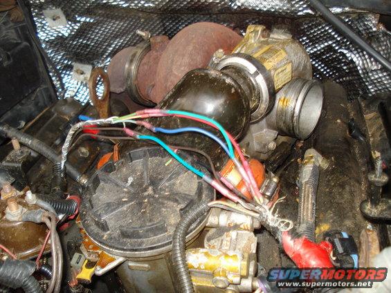 Turbocharger with wiring harness connected to engine components