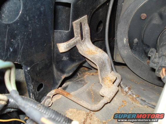 Rusty engine bracket with mounting holes