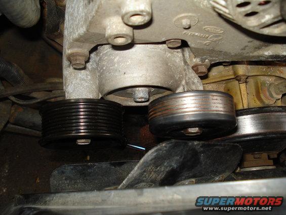 Engine pulleys and fan with visible Ford logo