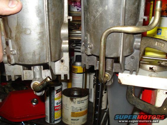 Two carburetors with metal fuel lines