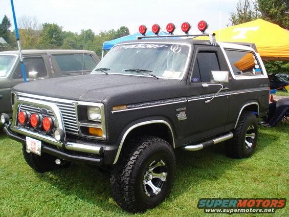 Black Ford Bronco with roof lights and brush guard