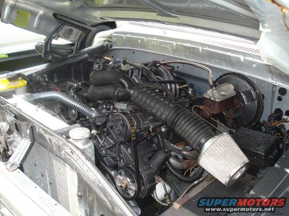 Engine bay with V8 engine, air intake, and radiator