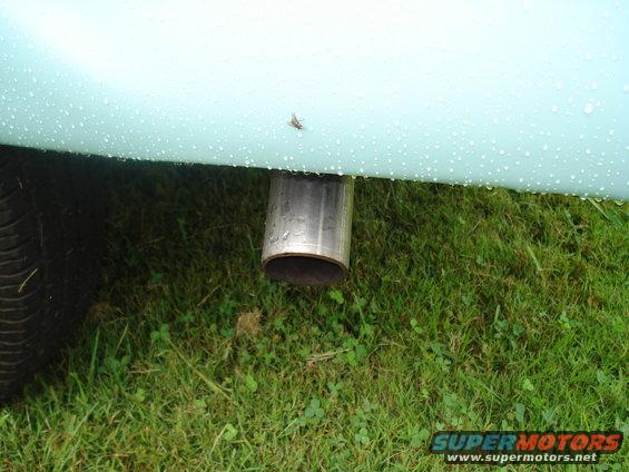 Light blue fender with water droplets and chrome exhaust pipe