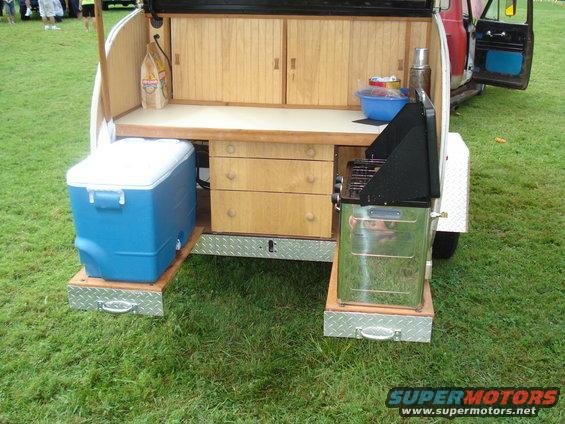 Teardrop trailer rear with built-in kitchen, cooler, and grill