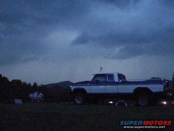 Side view of a blue and white pickup truck from the late 1970s