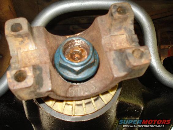 Driveshaft U-joint with blue nut and part number 514 visible
