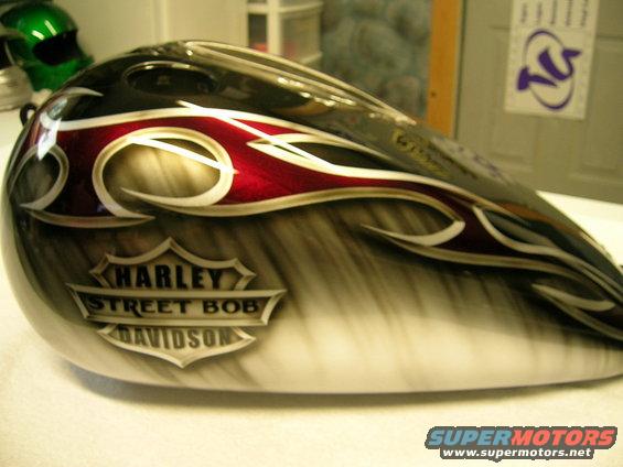Motorcycle fuel tank with flames and Harley-Davidson Street Bob badge