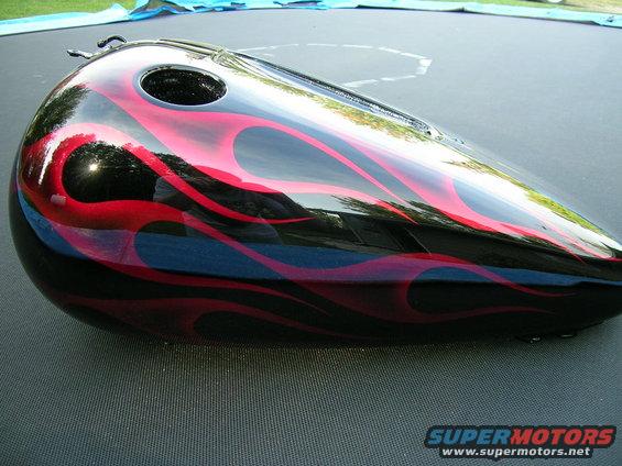 Motorcycle gas tank with black and red flame paint job