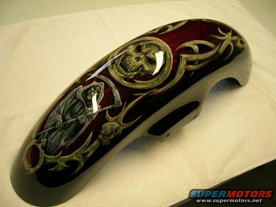 Motorcycle fender with grim reaper and skull airbrush art. Dark red with tribal accents