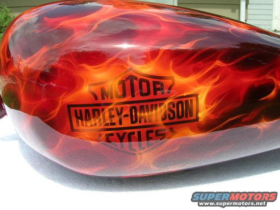 Motorcycle gas tank with flame paint and Harley-Davidson logo